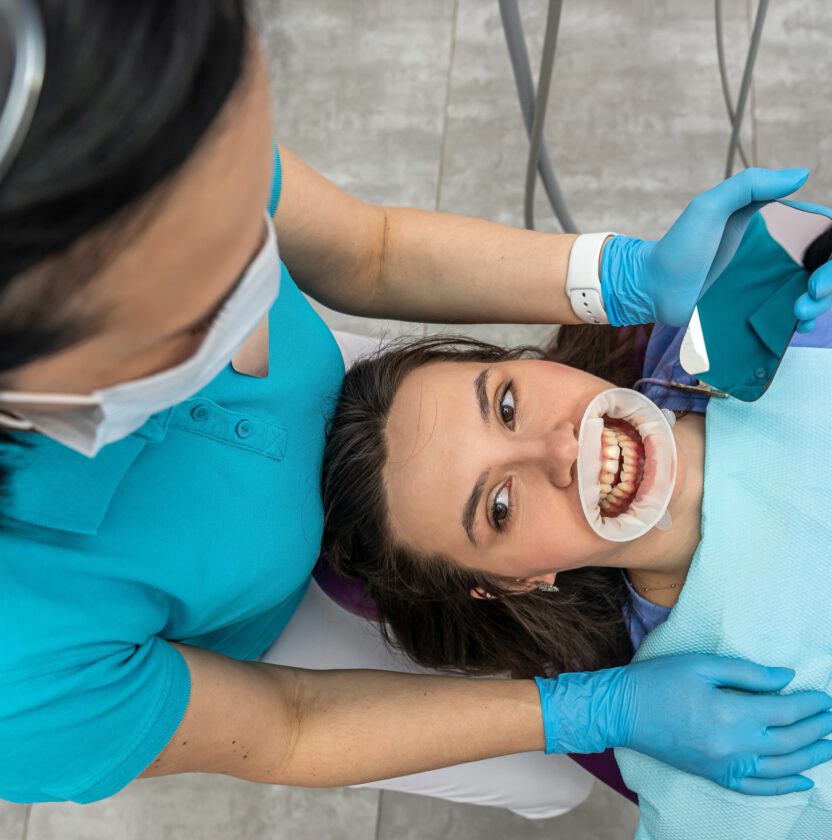 Patient having digital photographs and a scan of their teeth taken